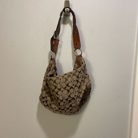 Coach woman’s brown canvas with twisted brown leather strap. - Picture 6 of 11